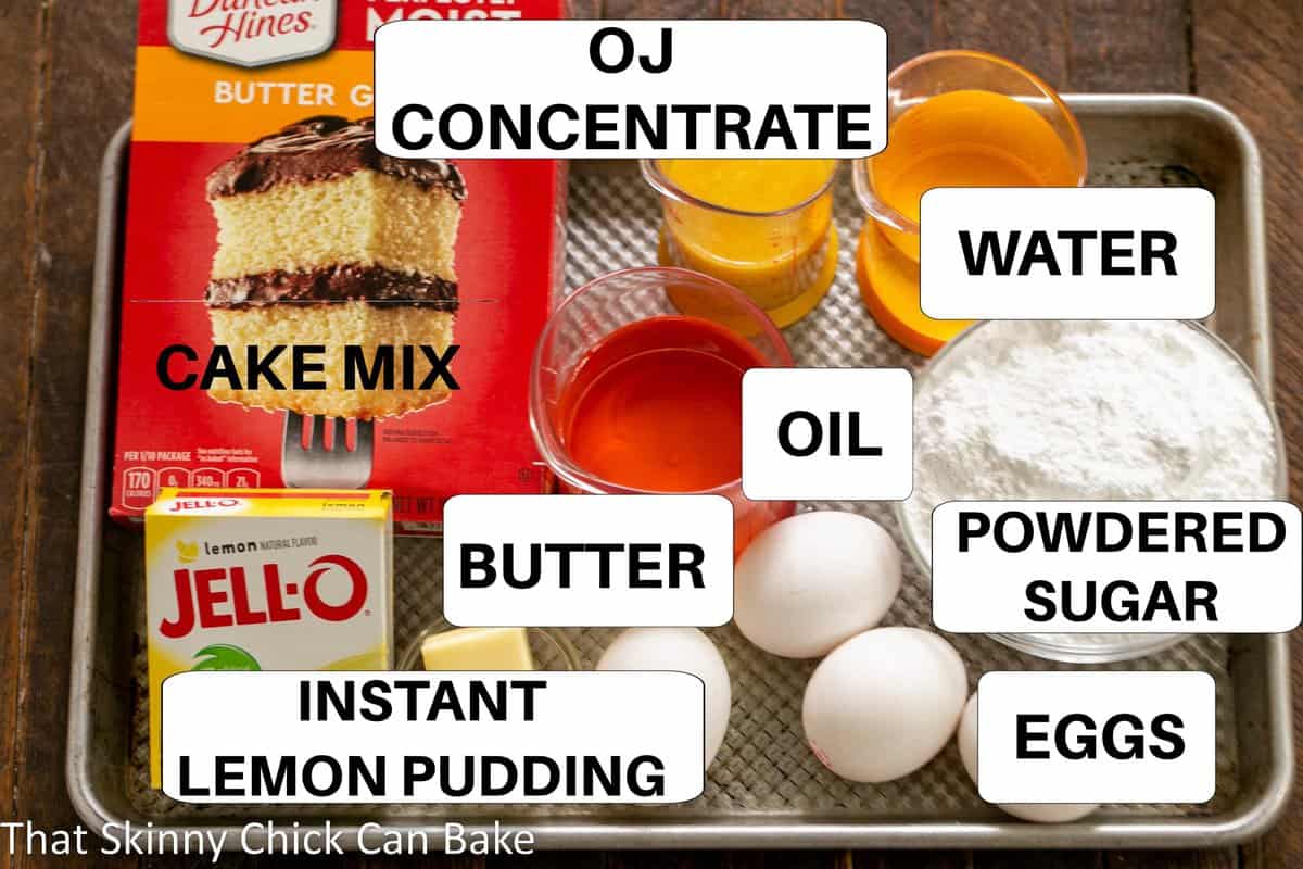 Lemon Bundt cake ingredients on a sheet pan with labels.