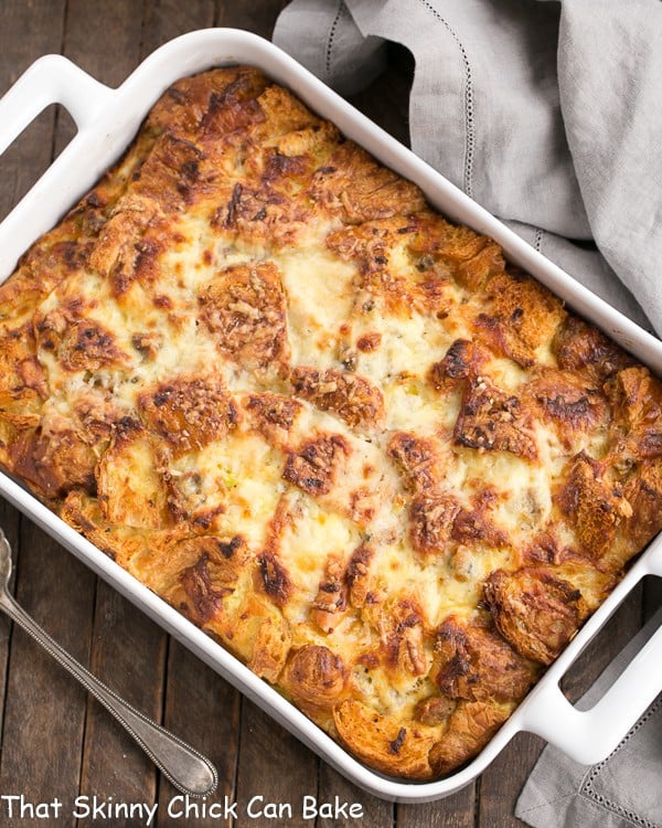 Overhead view of Sausage Croissant French Toast Casserole in a white baking dish