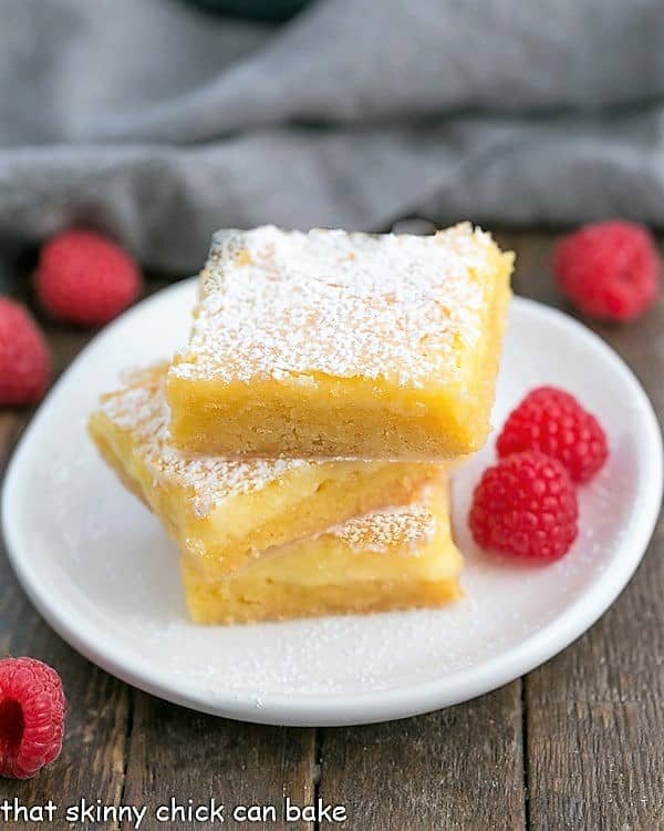 stack of Gooey Butter Bars on a dessert plate