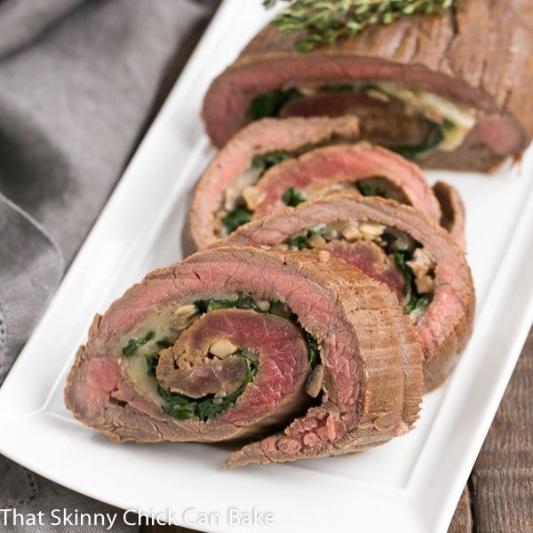 Flank Steak Roulades on a white rectangular tray.