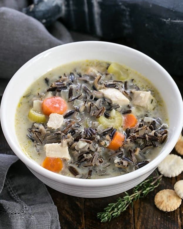 Closeup of a bowl of wild rice soup from above