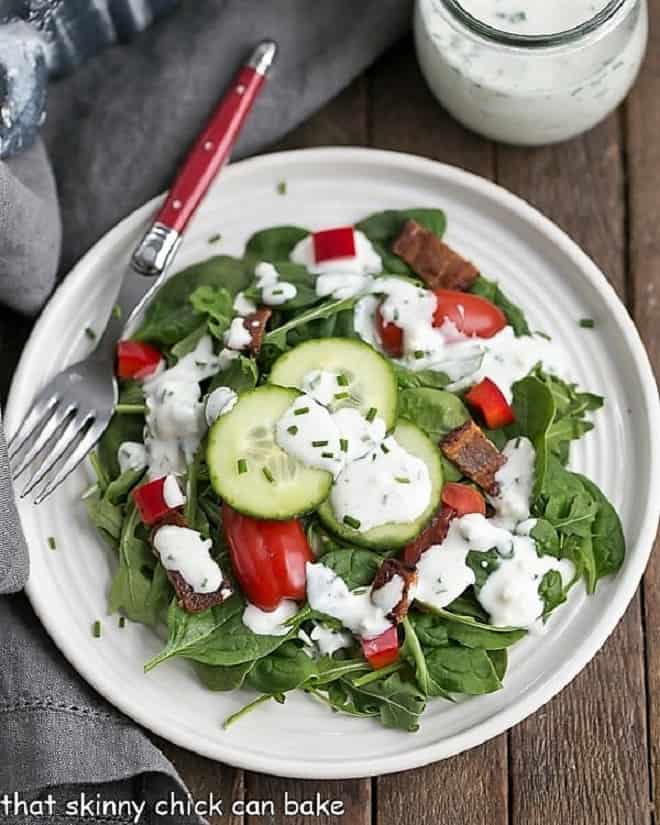 Overhead view of the Best Blue Cheese Salad Dressing on a green salad