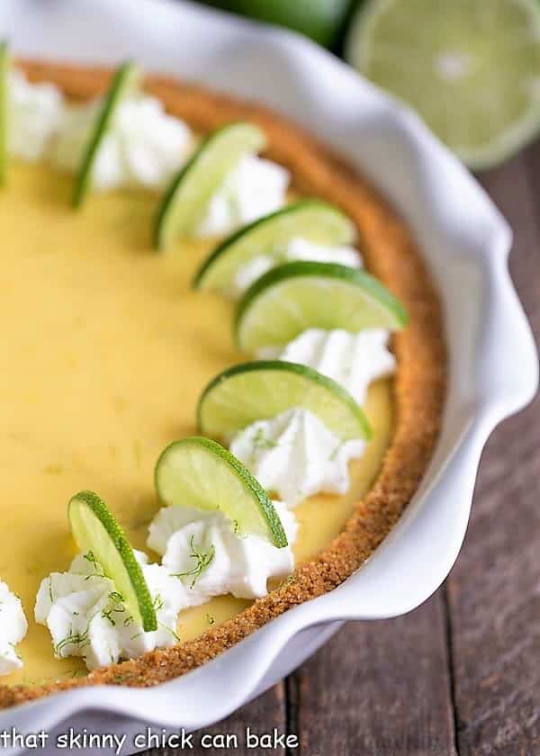 Close up view of Key Lime Pie with Graham Cracker Crust in a white pie plate