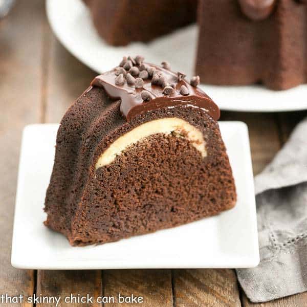 Cheesecake Stuffed Chocolate Bundt Cake slice on a square white plate