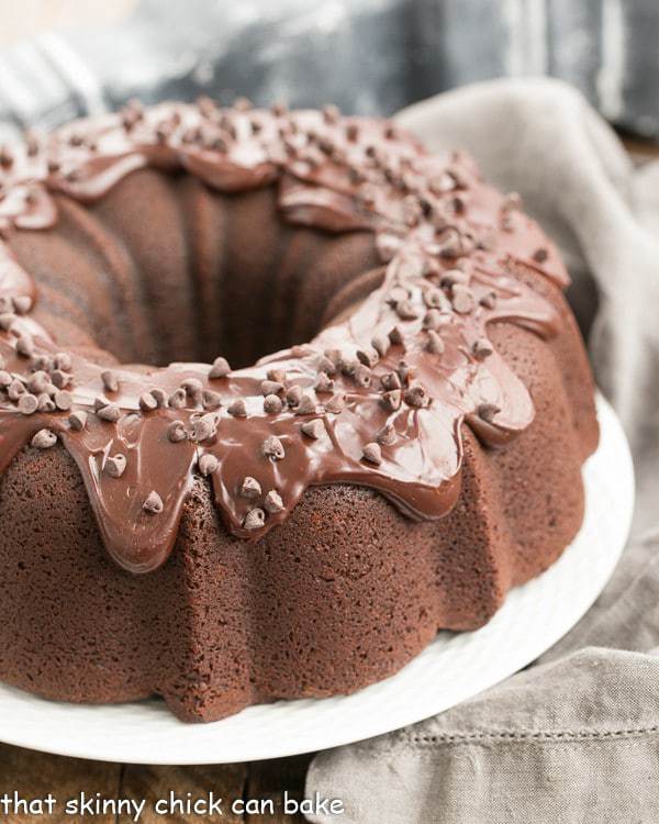 Cheesecake Stuffed Chocolate Bundt Cake on a cake platter.