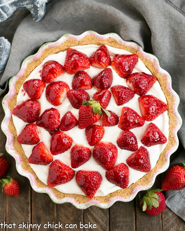 Overhead view of a Strawberry Cream Pie topped with berries