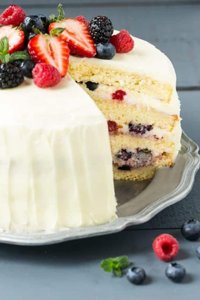 Berry Chantilly Cake with a slice removed