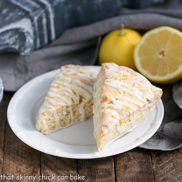 2 Glazed Lemon Tea Scones on a round white plate.