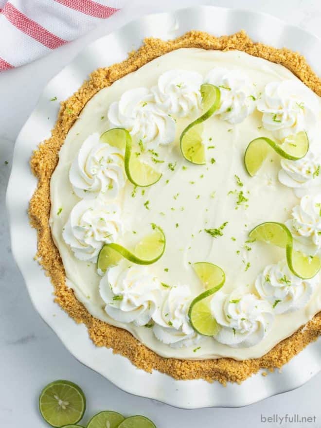 Overhead view of Key lime pie in a white pie plate