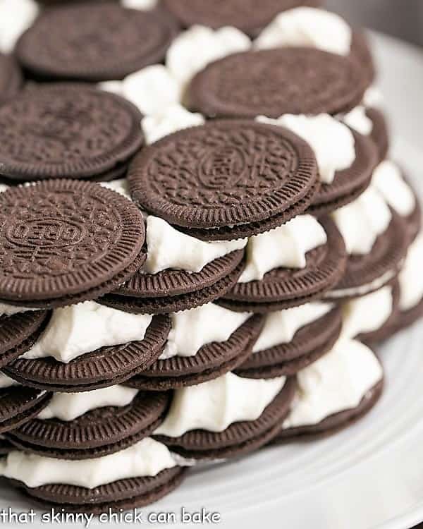 Close view of oreo icebox cake recipe on a white plate.