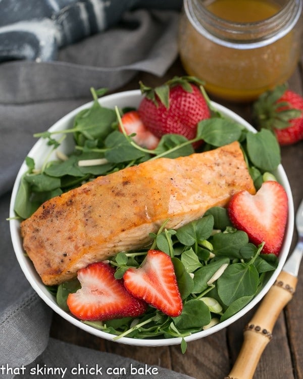 Salmon Watercress Salad with Strawberry Vinaigrette in a white salad bowl