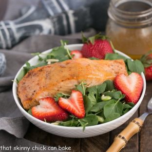 Salmon Watercress Salad with Strawberry Vinaigrette | Tender, peppery greens tossed with a berry vinaigrette and topped with roasted salmon