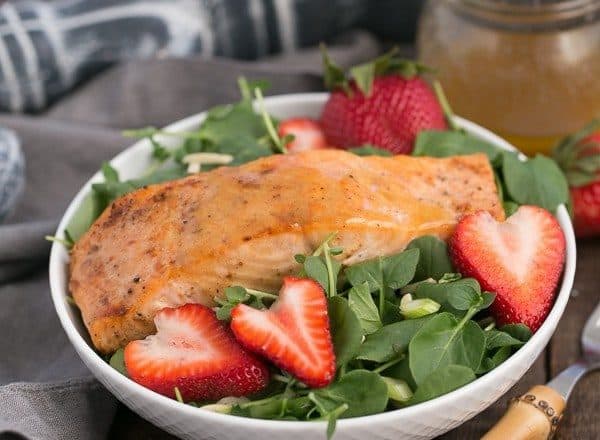 Salmon Watercress Salad with Strawberry Vinaigrette | Tender, peppery greens tossed with a berry vinaigrette and topped with roasted salmon
