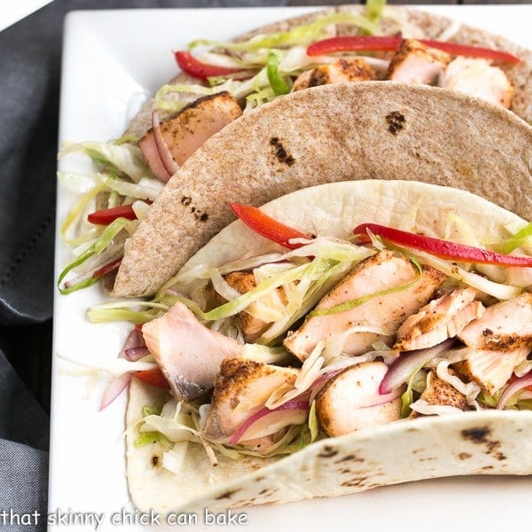 Best Fish Tacos Recipe with Mango Salsa on a square ceramic plate