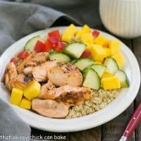 Caribbean Salmon Quinoa Salad | Perfectly portioned, healthy salad with quinoa, mangoes, jerk seasoned salmon and vegetables!