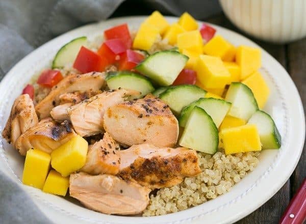 Caribbean Salmon Quinoa Salad | Perfectly portioned, healthy salad with quinoa, mangoes, jerk seasoned salmon and vegetables!