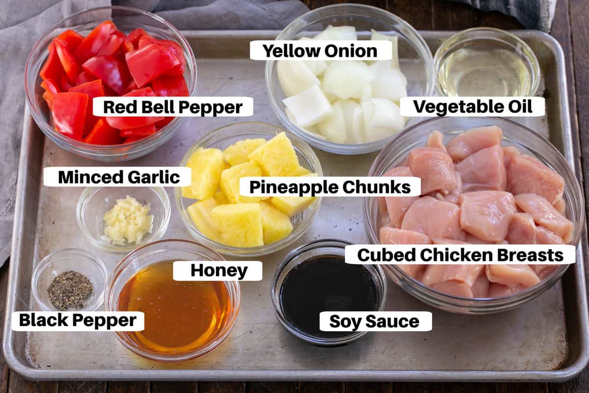 Chicken Kabob Ingredients with labels on a metal sheetpan.