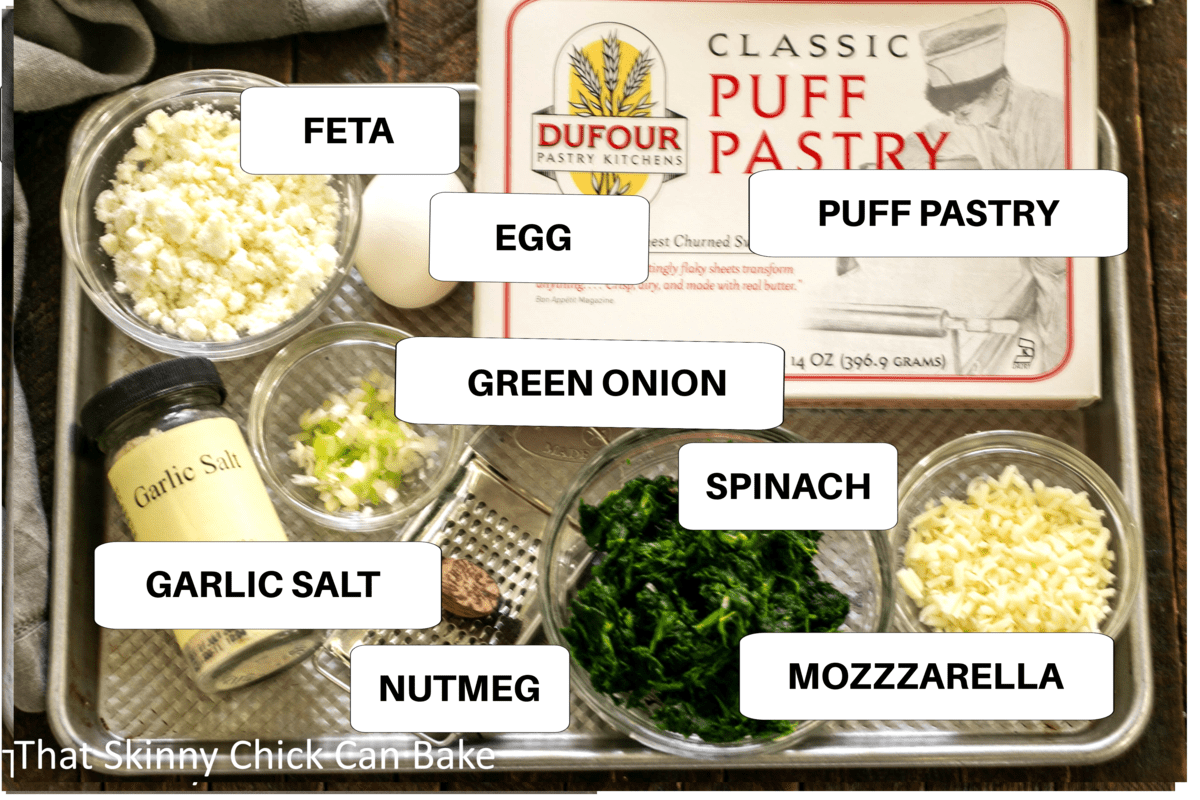 Labeled pinwheel ingredients on a metal sheetpan.