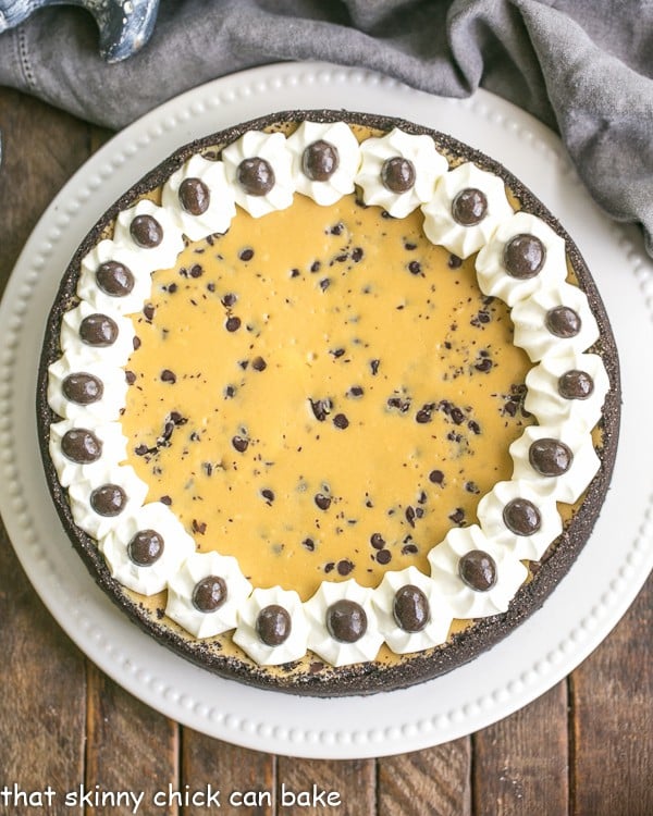 Overhead view of Mocha Cheesecake with Chocolate Chips on a white cake plate