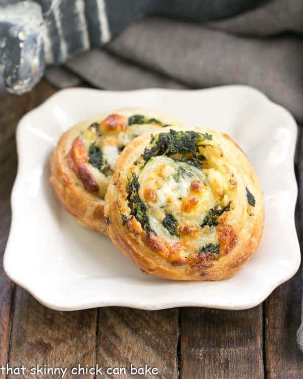 Spinach Feta Pinwheels on a white square plate.