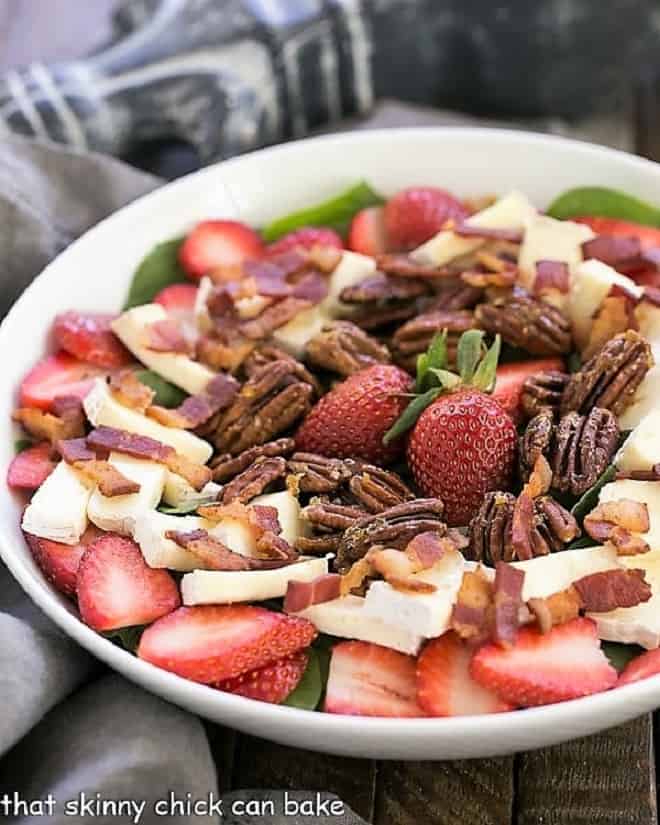 Strawberry Bacon Brie Salad in a white serving bowl.