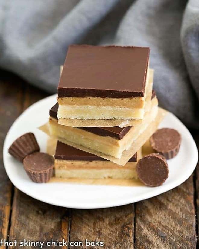 Tagalong Cookie Bars stacked on a white plate.