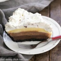 Triple Chocolate Layer Pie Recipe | Cookie crust, 3 rich custards and a cloud of whipped cream!