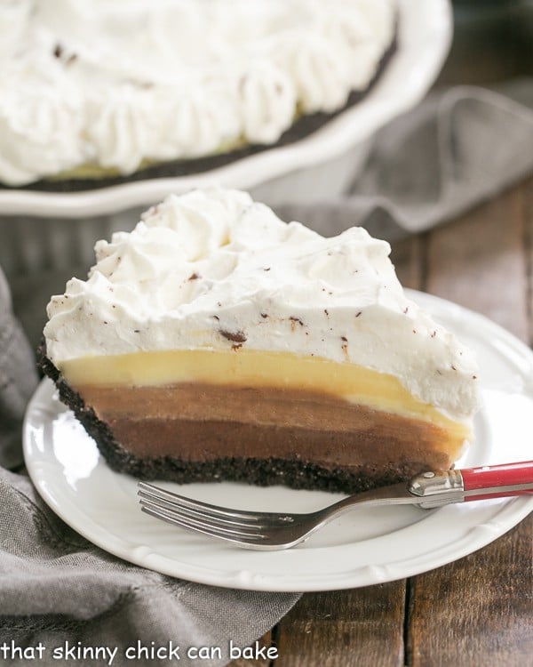 Triple Chocolate Layer Pie Recipe slice on a white dessert plate.