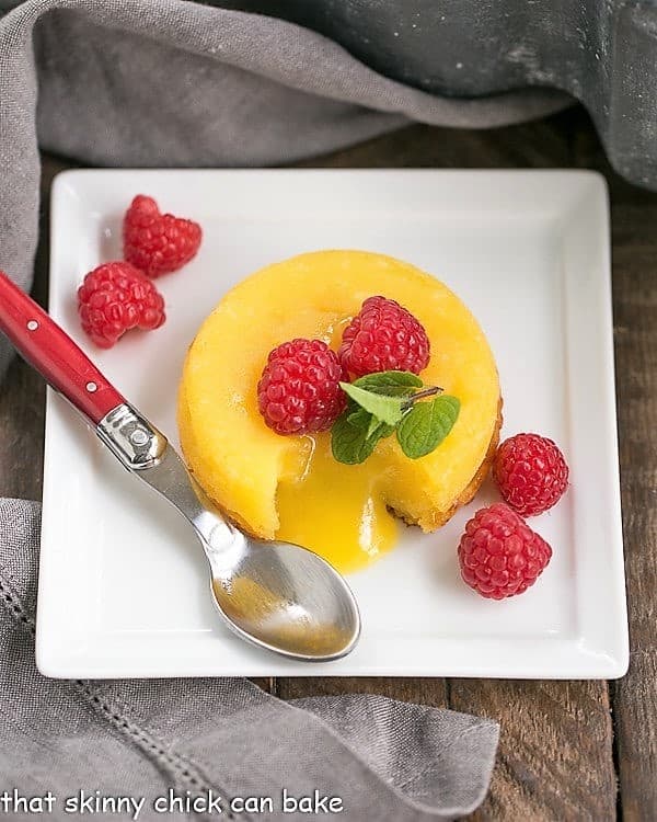 White Chocolate Molten Lava Cakes on a square, white ceramic plate.