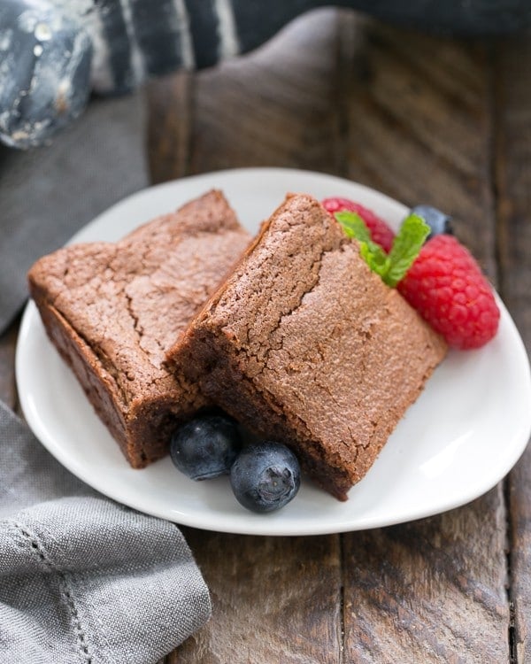 Simple Fudgy Brownies - An unusual technique to make the fudgiest brownies ever! Simple Fudgy Brownies garnished with berries