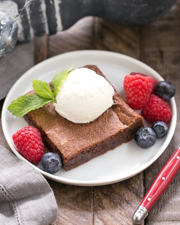 Simple Fudgy Brownies with a dollop of whipped cream