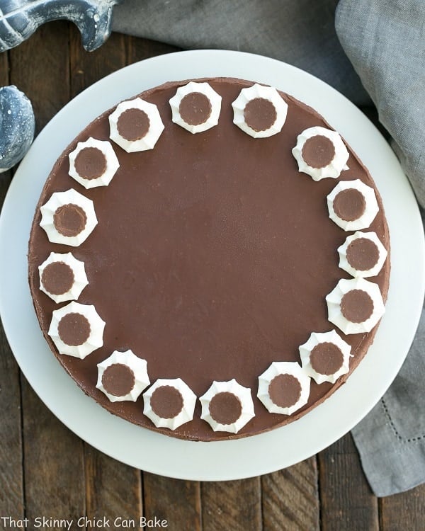 Overhead view of a Chocolate Peanut Butter Pie on a white cake plate.