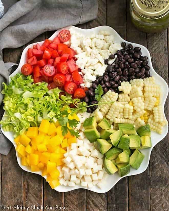 Overhead view of a Mexican Chopped Salad on a white serving plate