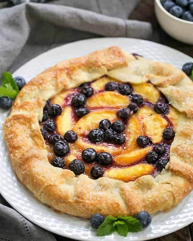 Peach Blueberry Galette on a white serving plate.
