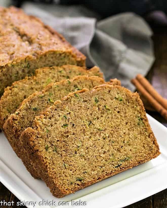 Cinnamon Zucchini Bread slices on a white tray.