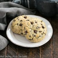 2 levain chocolate chip cookies on a round white plate