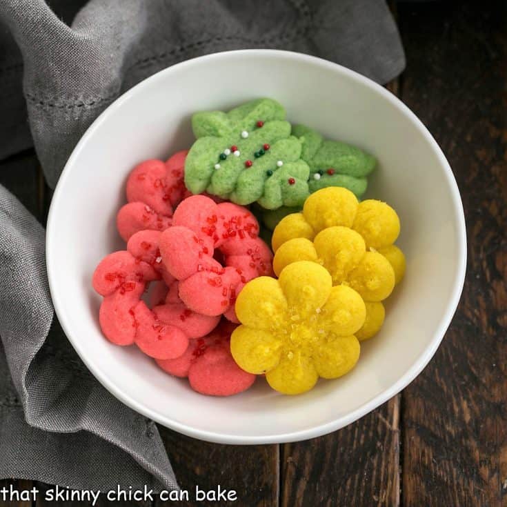 Overhead view of buttery spritz cookies in a small white bowl