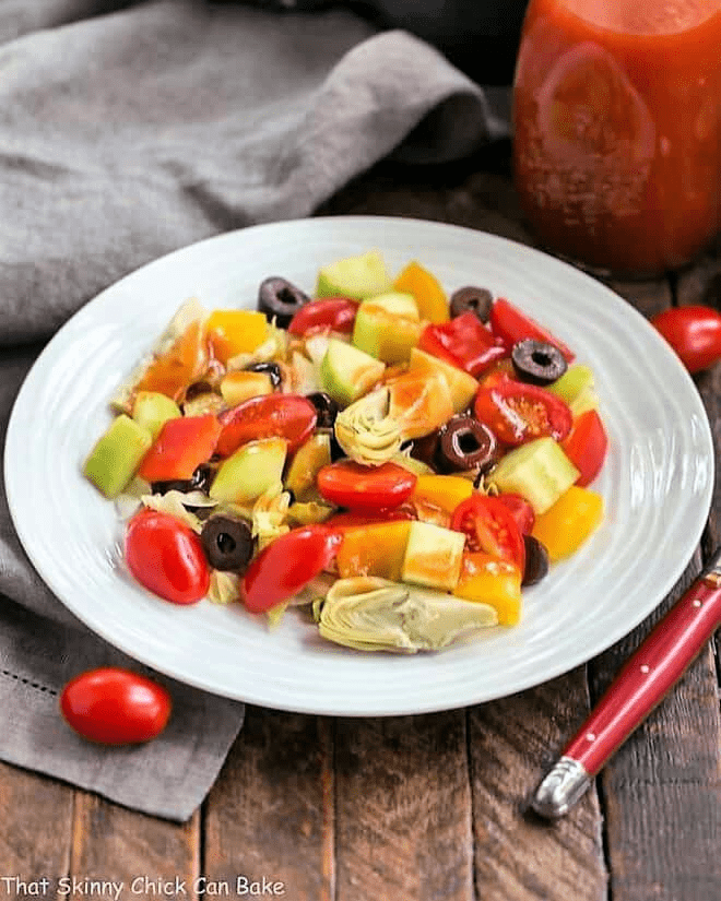 Easy Honey French Salad Dressing on a green salad on a white ceramic plate.