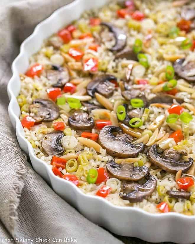 Italian Rice Pilaf with Toasted Almonds - Super easy, scrumptious, oven baked rice! Italian Rice Pilaf with Toasted Almonds in a shallow casserole dish.