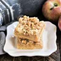 Caramel Apple Pie Toffee Bars stacked on a white plate