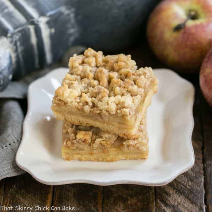 Caramel Apple Pie Bars | Dreamy layers of shortbread, apples, toffee bits and streusel!