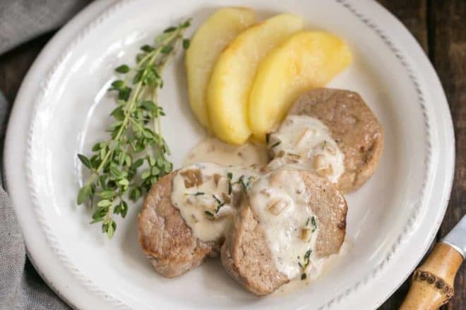 Apple Topped Pork Medallions with Calvados Cream Sauce | A gourmet entree that's easy enough for a weeknight!