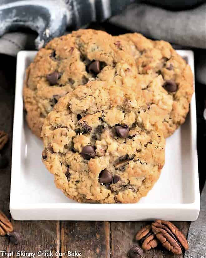 Loaded Cowboy Cookies on a square white plate.