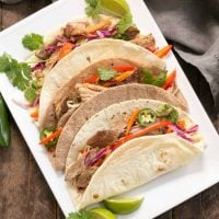 Slow Cooker Asian Pork Tacos with Cabbage Slaw | Shredded pork tacos with an Asian twist!