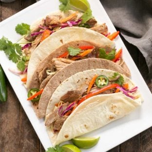 Slow Cooker Asian Pork Tacos with Cabbage Slaw | Shredded pork tacos with an Asian twist!