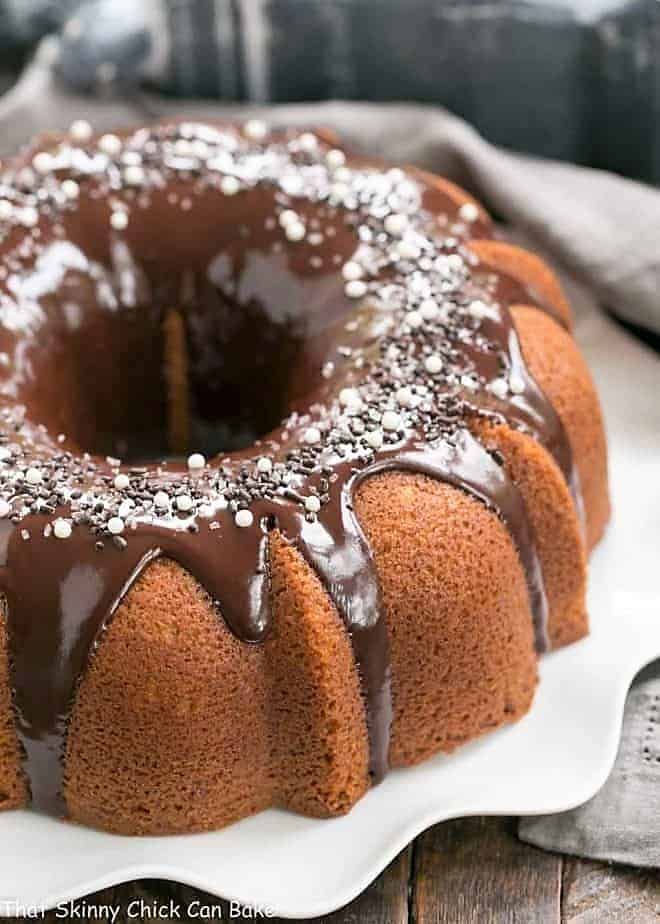 Tunnel of Fudge Cake on a white serving plate.