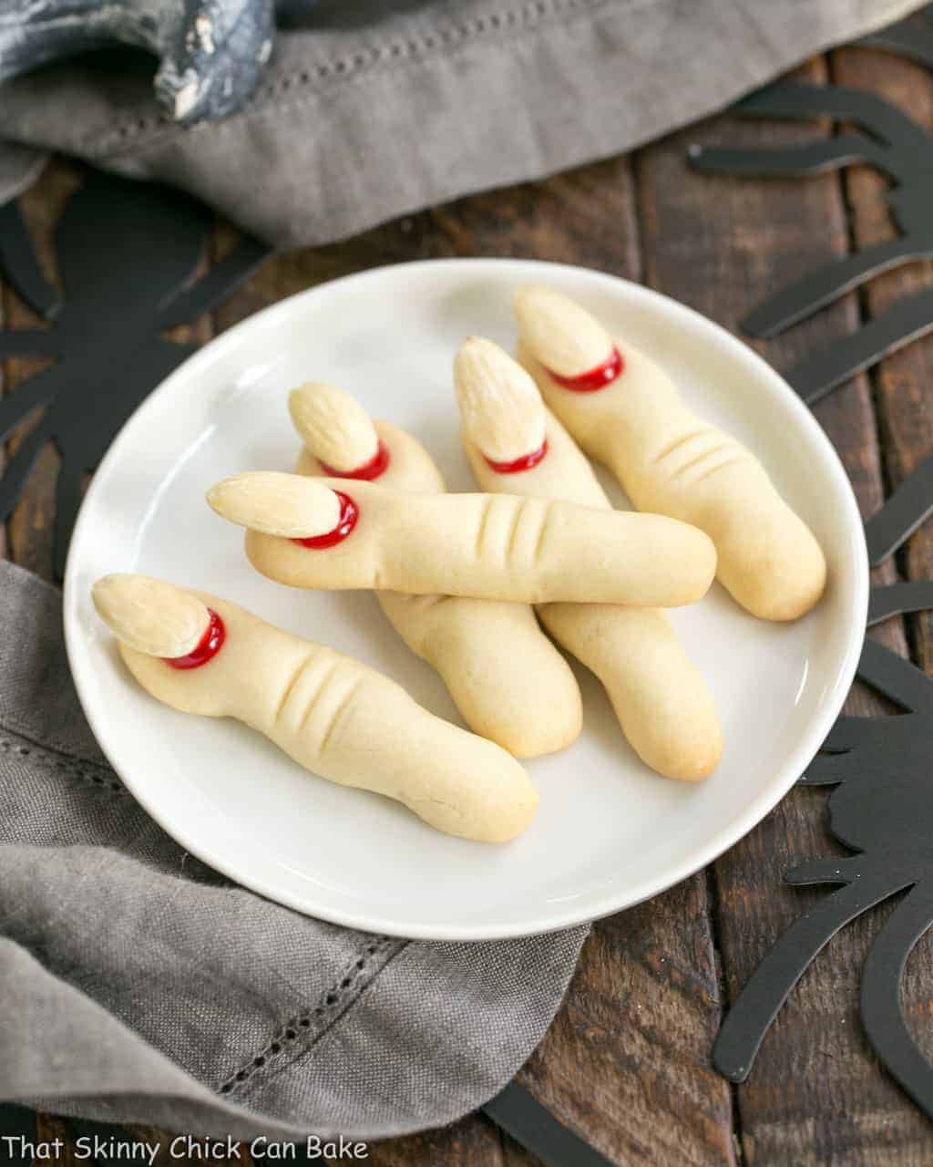 Witches Fingers Cookies on a round white ceramic plate.