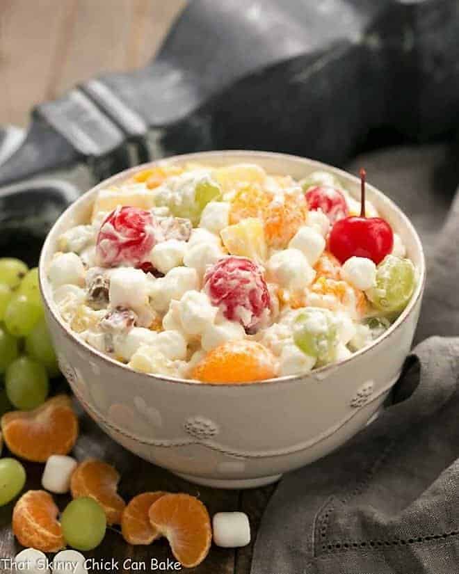 The Best Ambrosia Salad {No Cool Whip} in a white ceramic bowl.