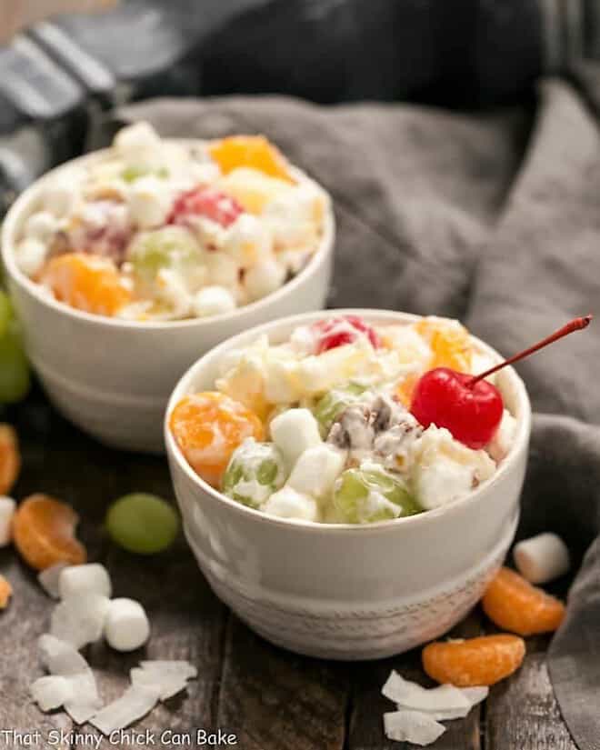 The Best Ambrosia Salad {No Cool Whip} in two small white bowls.