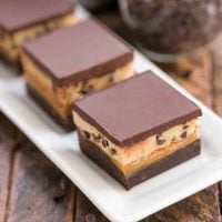 Cookie Dough Billionaire Bars | Layers of brownies, caramel, cookie dough and ganache for an outrageously rich dessert!